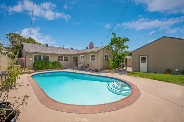 a patio with table and chairs