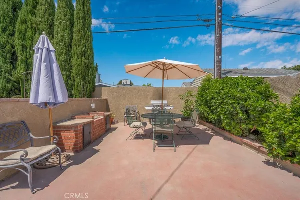 a white toilet sitting next to a shower