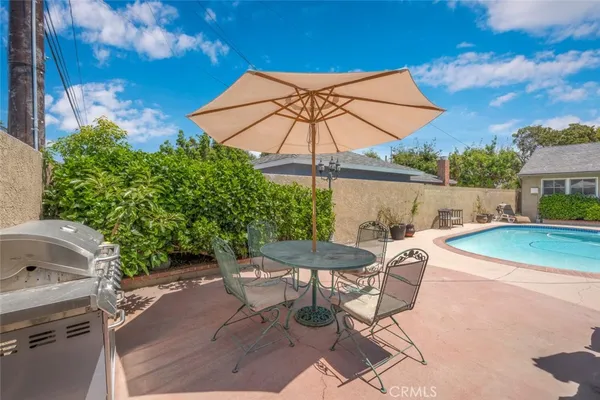 a kitchen with stainless steel appliances granite countertop a refrigerator and a stove