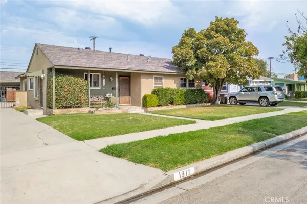 front view of a house with a yard