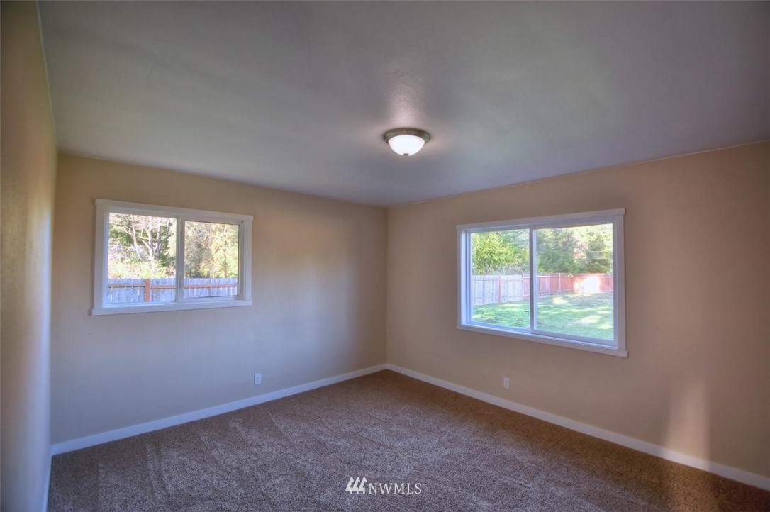 8231 James Road Southwest Rochester, WA 98579 - Photo 17 of 25 an empty room with a window