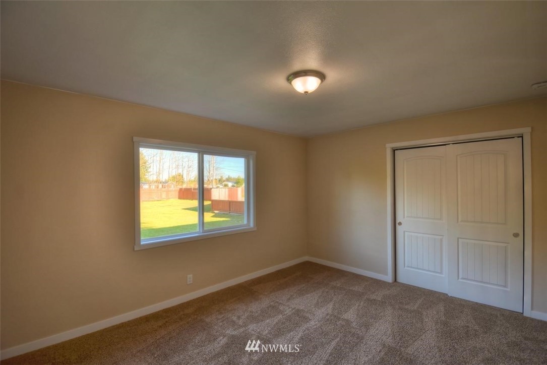 8231 James Road Southwest Rochester, WA 98579 - Photo 18 of 25 an empty room with a window