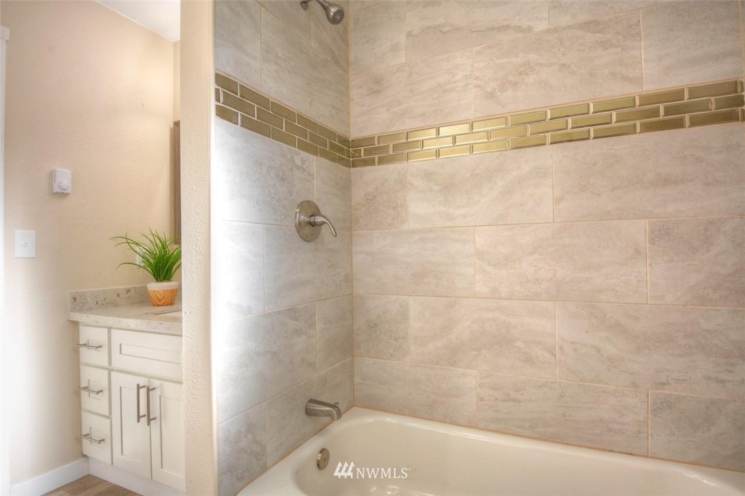 8231 James Road Southwest Rochester, WA 98579 - Photo 20 of 25 a bathroom with a bathtub and shower