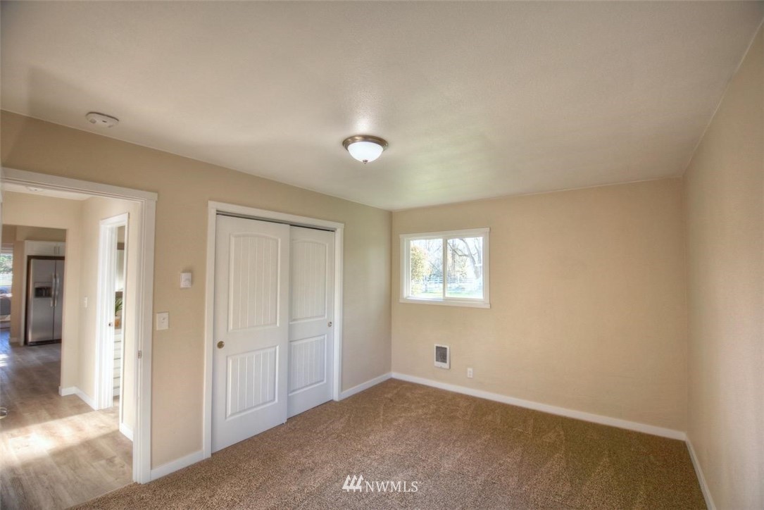 8231 James Road Southwest Rochester, WA 98579 - Photo 21 of 25 an empty room with windows and closet