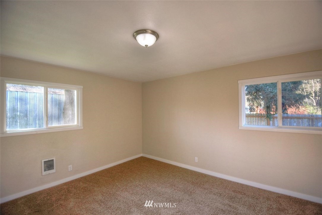 8231 James Road Southwest Rochester, WA 98579 - Photo 22 of 25 an empty room with windows