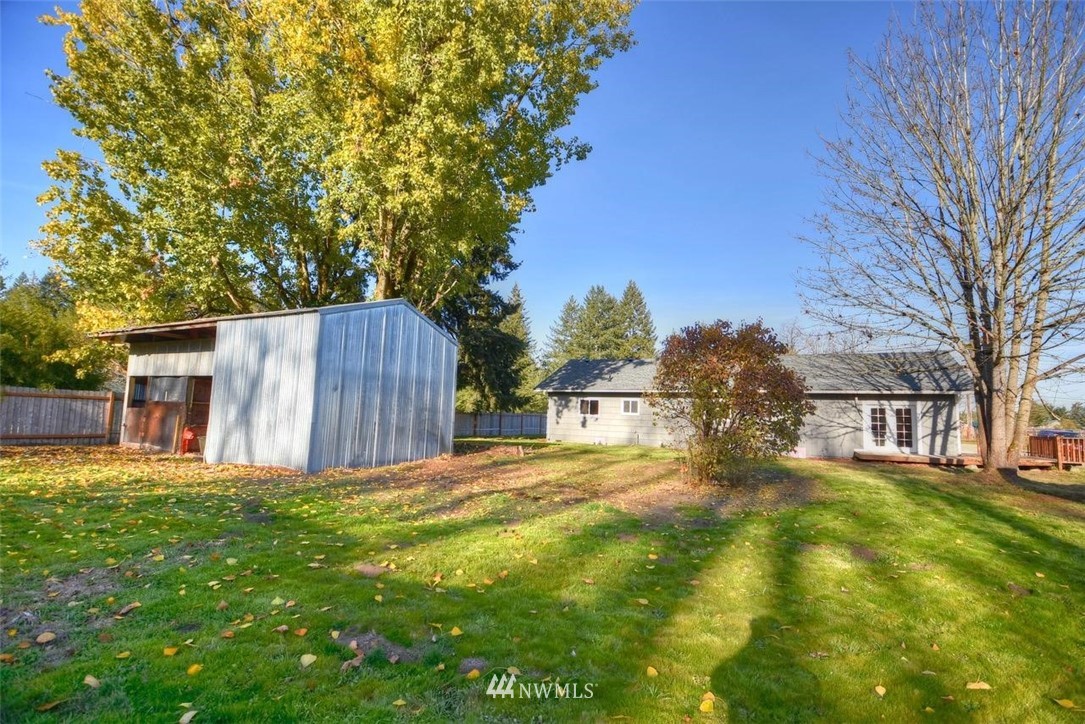 8231 James Road Southwest Rochester, WA 98579 - Photo 24 of 25 a view of a yard with wooden fence