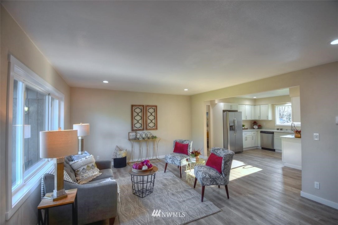 8231 James Road Southwest Rochester, WA 98579 - Photo 5 of 25 a living room with furniture and wooden floor