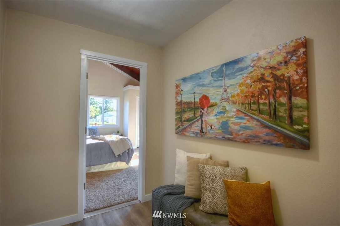 8231 James Road Southwest Rochester, WA 98579 - Photo 10 of 25 a living room with furniture and a painting on the wall