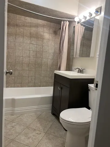 a bathroom with a sink a toilet and a bathtub