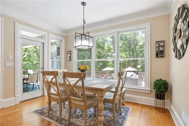 a view of a dining room with furniture window and wooden floor