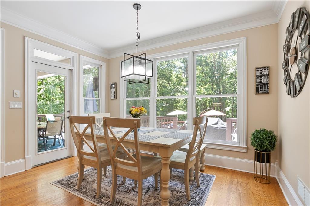 4185 Pool Road Winston, GA 30187 - Photo 12 of 57 a view of a dining room with furniture window and wooden floor