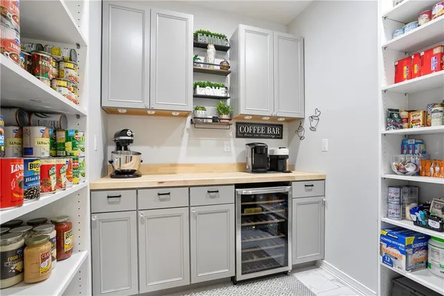 a utility room with sink dryer and washer
