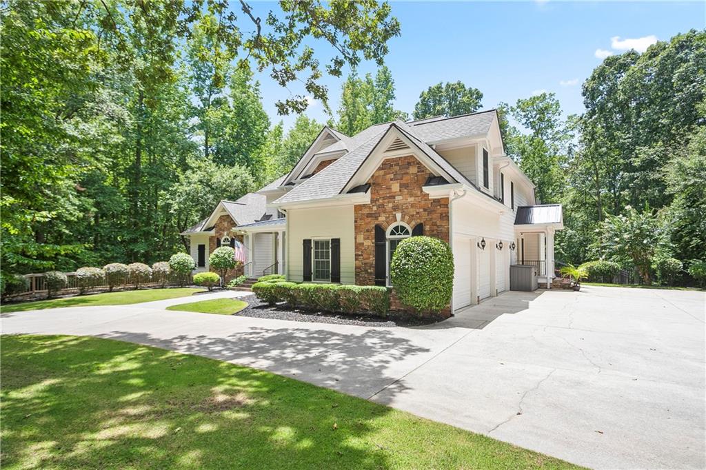4185 Pool Road Winston, GA 30187 - Photo 2 of 57 a front view of a house with a yard and potted plants