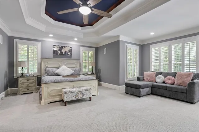 a view of bedroom with furniture and flat screen tv