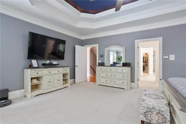 a spacious bathroom with a tub sink and mirror