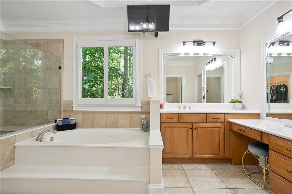 4185 Pool Road Winston, GA 30187 - Photo 28 of 57 a spacious bathroom with a tub sink and mirror