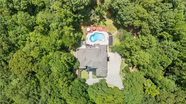 an aerial view of a house with outdoor space