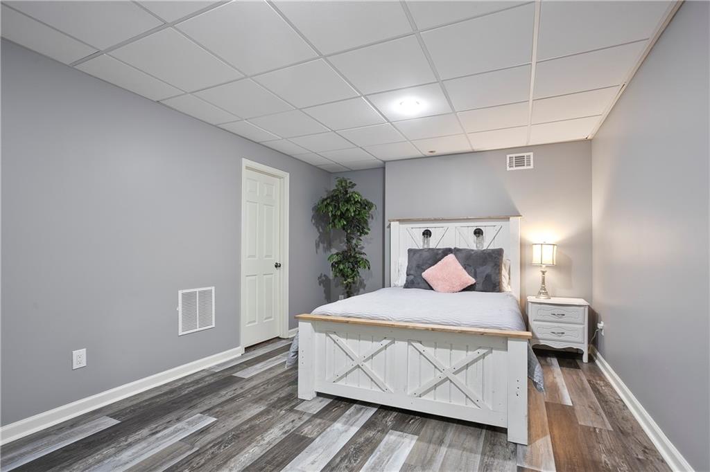 4185 Pool Road Winston, GA 30187 - Photo 48 of 57 a bedroom with a bed and a potted plant