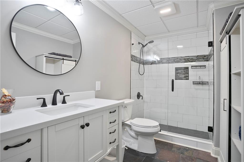 4185 Pool Road Winston, GA 30187 - Photo 49 of 57 a bathroom with a toilet a sink and mirror