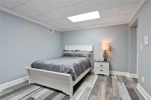 a view of a house with pool and chairs