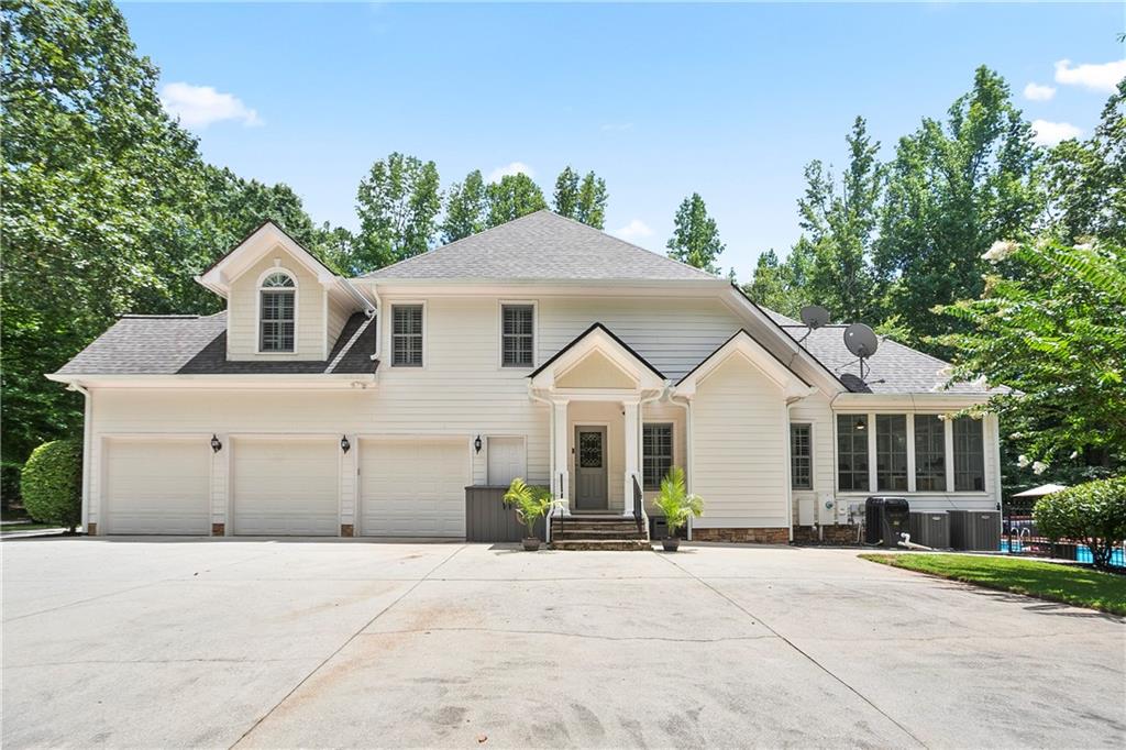 4185 Pool Road Winston, GA 30187 - Photo 5 of 57 a front view of a house with a yard and trees