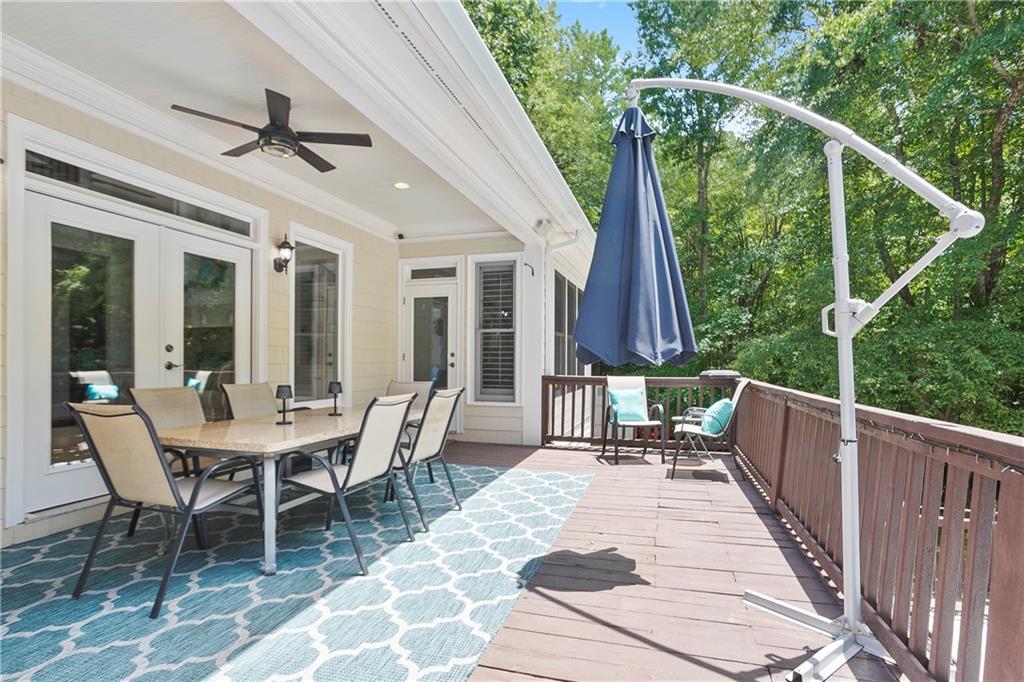 4185 Pool Road Winston, GA 30187 - Photo 53 of 57 a view of a patio with a dining table and chairs