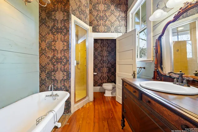 a bathroom with a sink a bathtub and a toilet