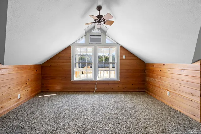 a view of room with window and ceiling fan