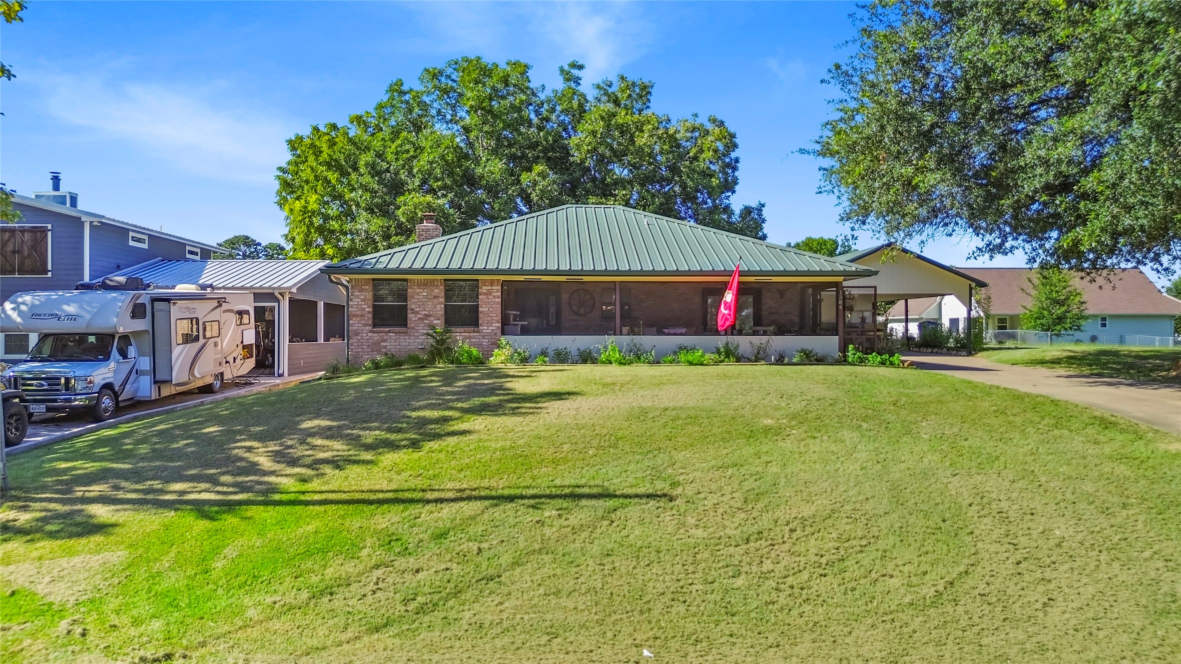 a house view with swimming pool and garden space