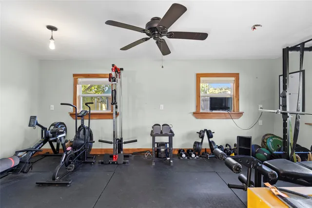 a room with gym equipment and a window