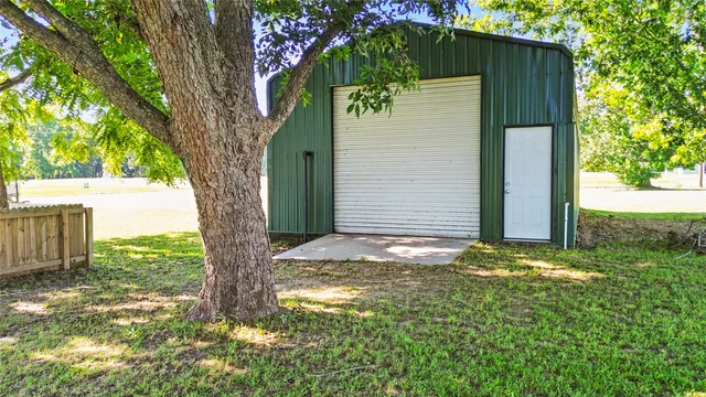 a view of a backyard of the house