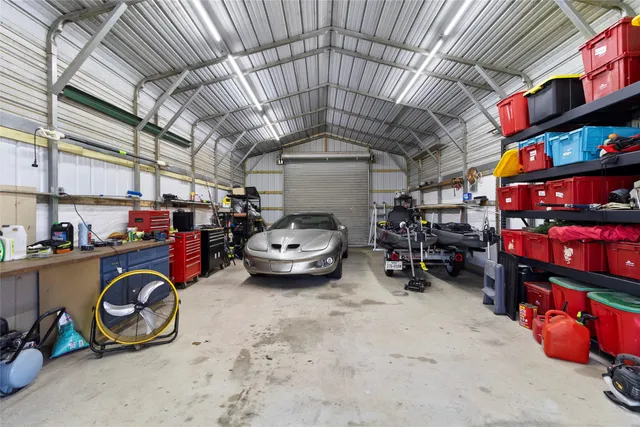 a view of parking garage with cars