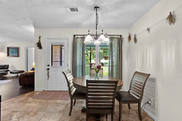 a view of a livingroom with furniture and window