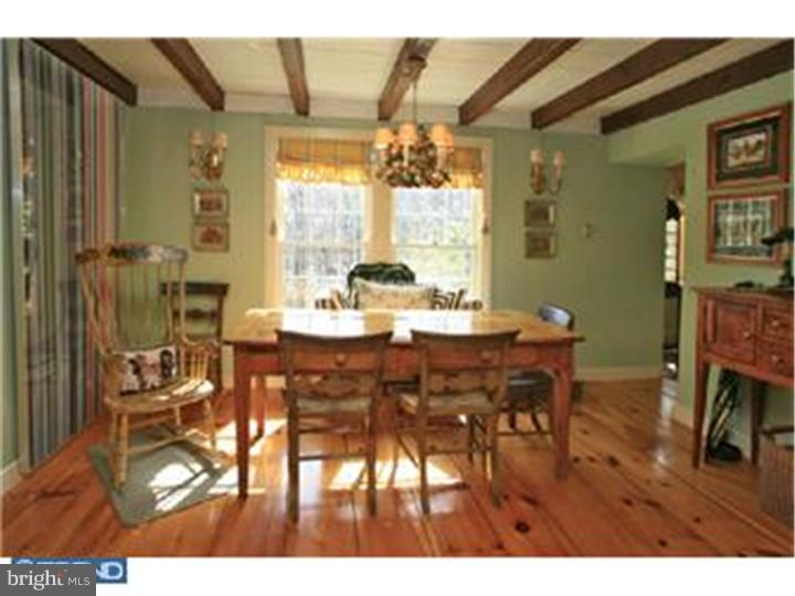 3451 Haupts Bridge Road Riegelsville, PA 18077 - Photo 14 of 23 a view of a dining room with furniture window and wooden floor