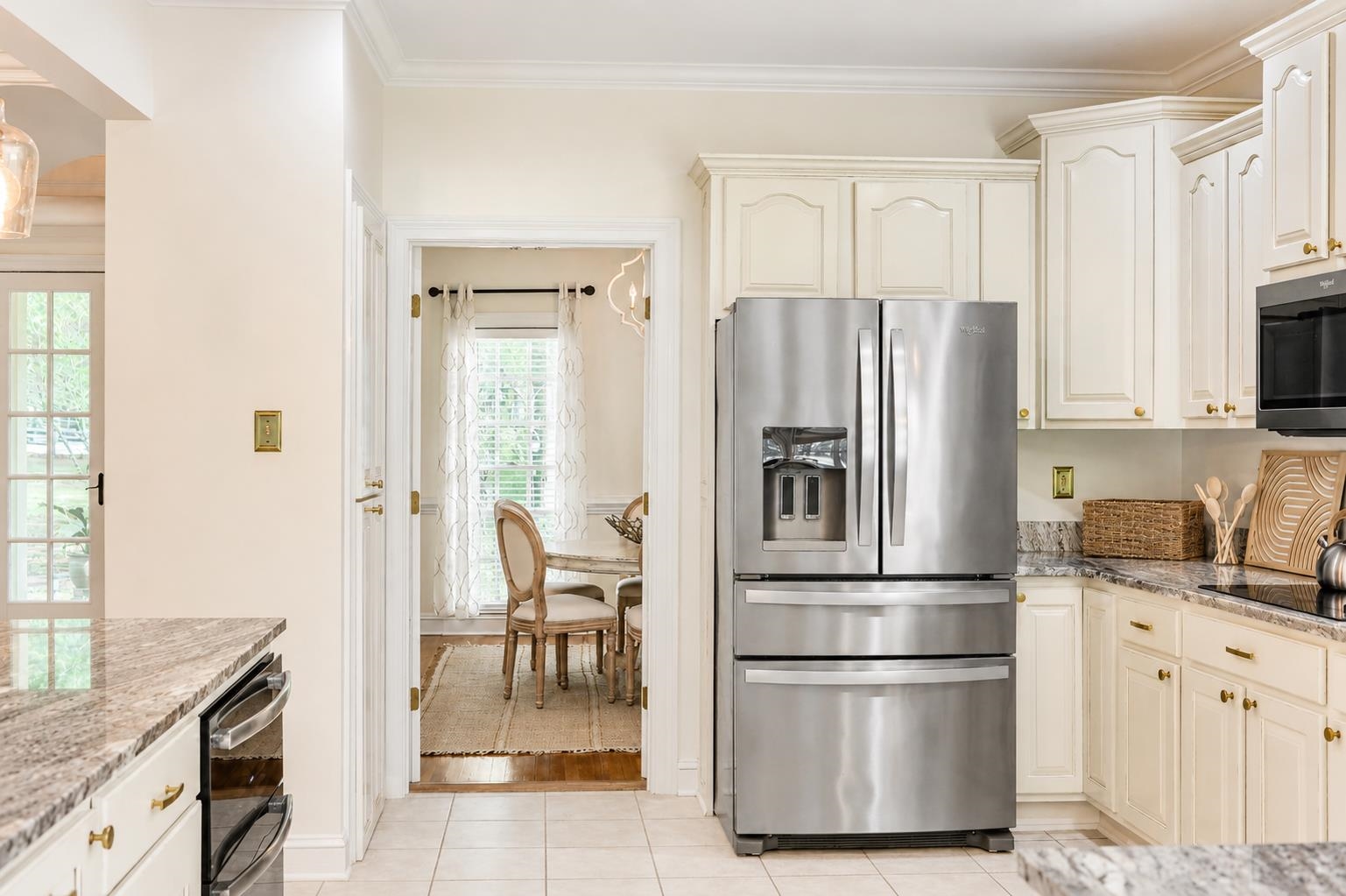 565 Schaeffer Loop Eads, TN 38028 - Photo 12 of 40 a kitchen with stainless steel appliances granite countertop a refrigerator and a stove top oven