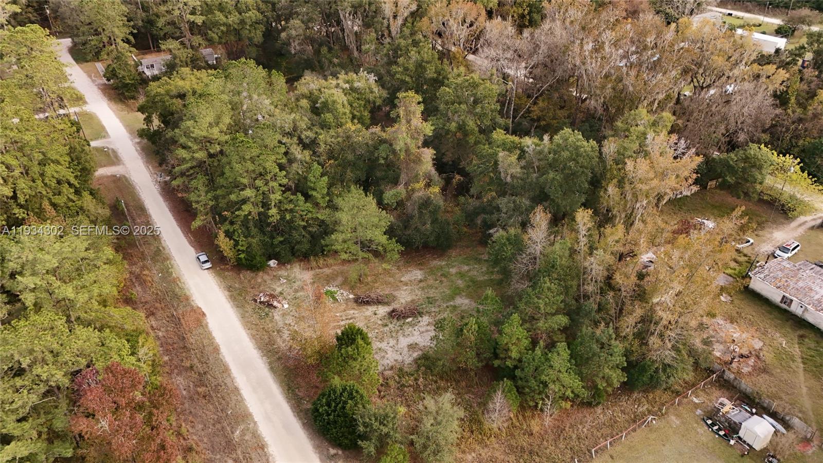 0 Southwest 2nd Court Ocala, FL 34476 - Photo 5 of 21 a view of a yard with plants and wooden fence