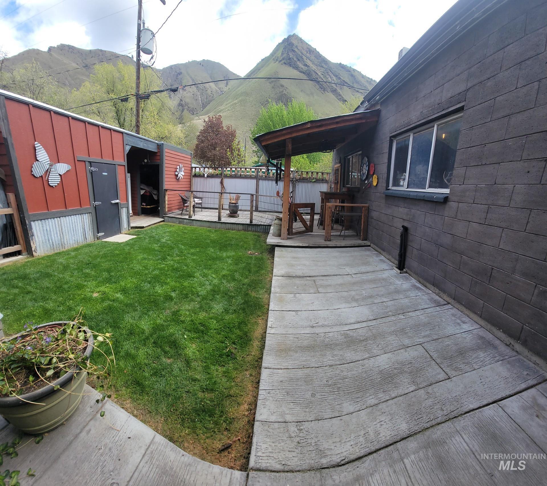 1006 Borah Avenue Riggins, ID 83549 - Photo 6 of 24 View of yard featuring a mountain view and an outbuilding