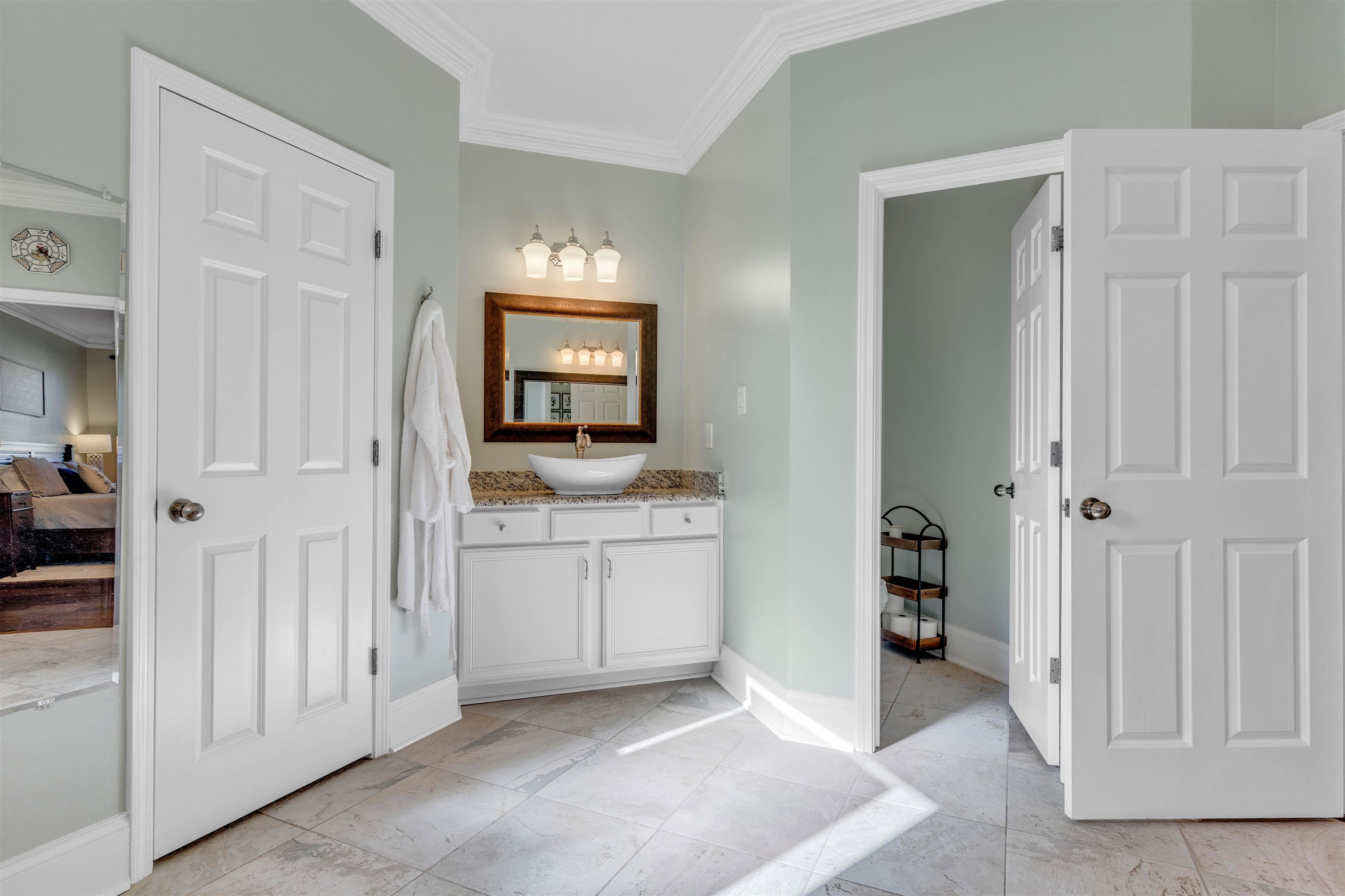 10489 Fireweek Lane Collierville, TN 38017 - Photo 14 of 39 a bathroom with a granite countertop sink and a mirror