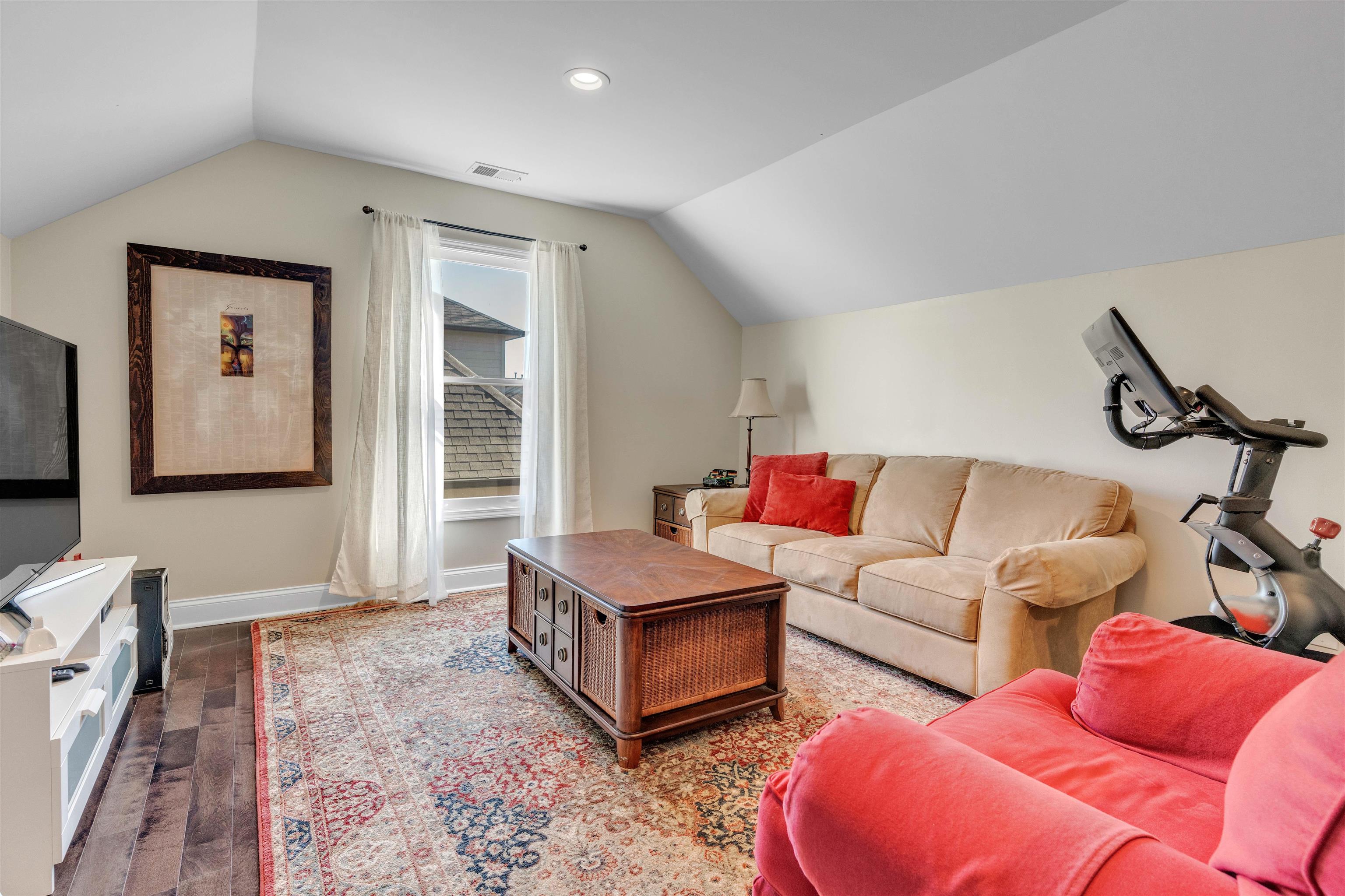 10489 Fireweek Lane Collierville, TN 38017 - Photo 21 of 39 a living room with furniture and a flat screen tv