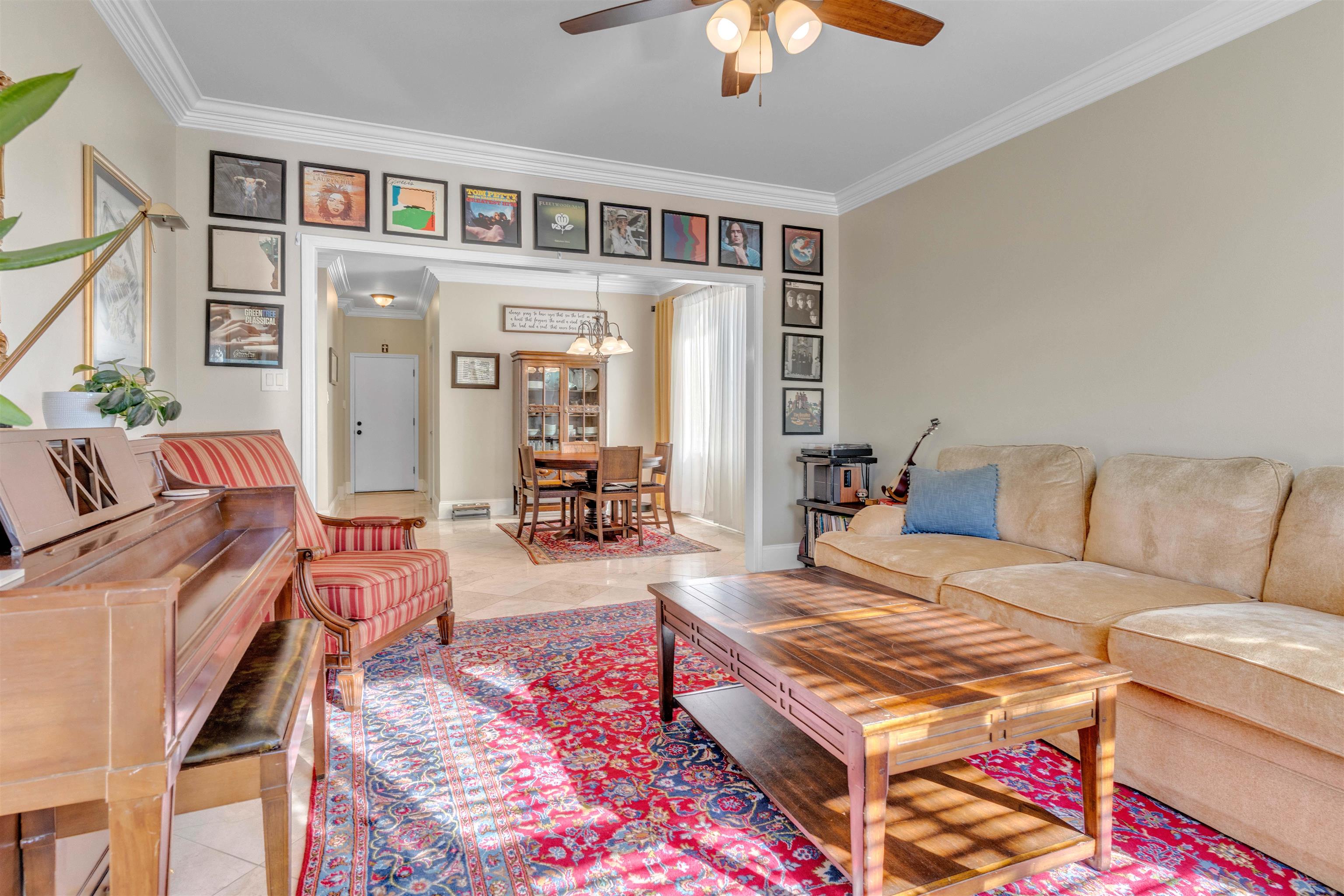 10489 Fireweek Lane Collierville, TN 38017 - Photo 28 of 39 a living room with furniture and a chandelier