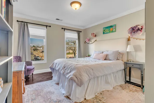 a bedroom with furniture and a window