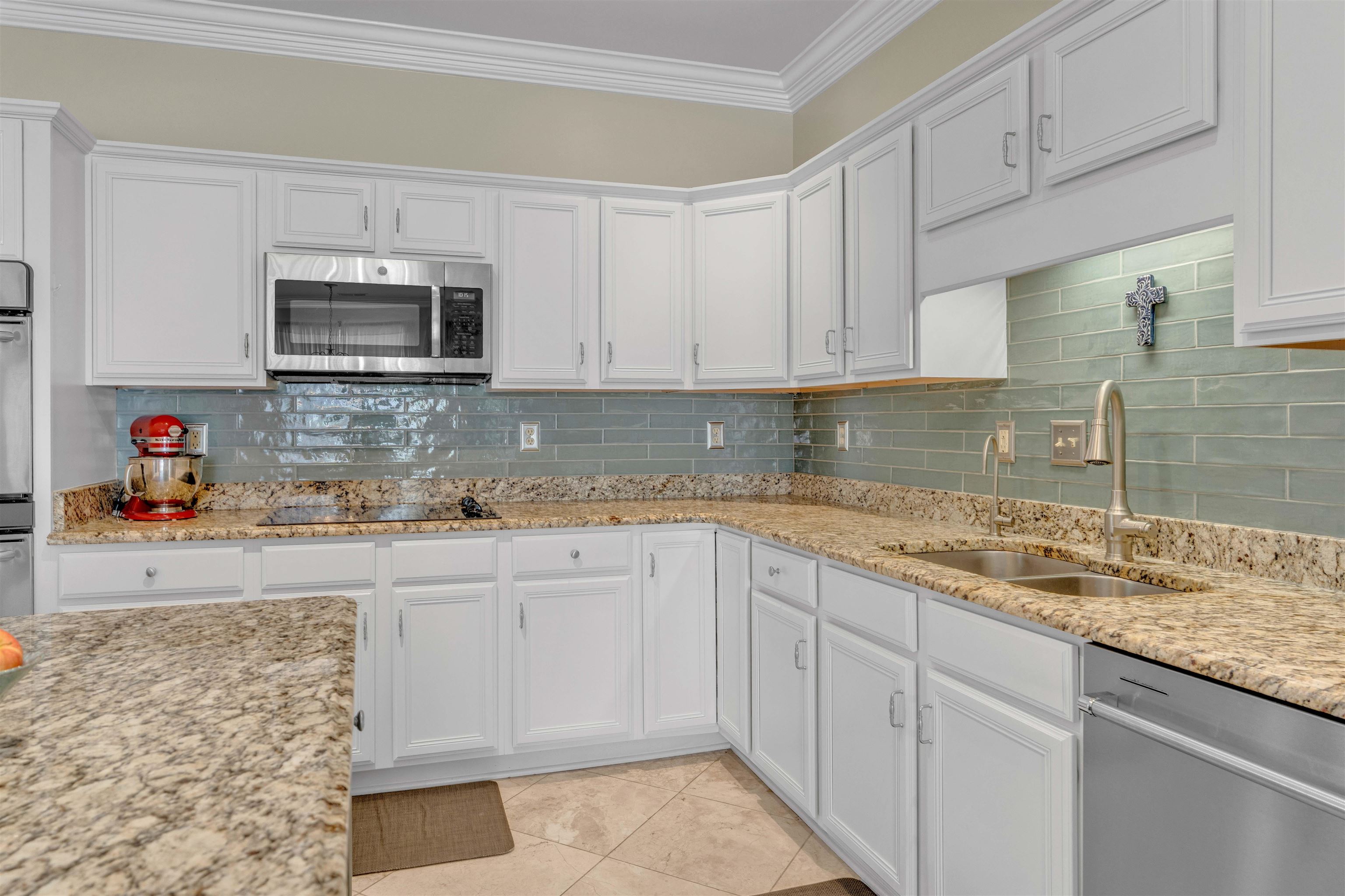 10489 Fireweek Lane Collierville, TN 38017 - Photo 7 of 39 a kitchen with stainless steel appliances granite countertop a sink stove and microwave