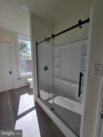 a bathroom with a tub and a window