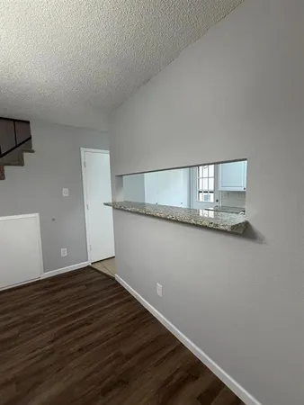 a view of wooden floor and staircase in a room