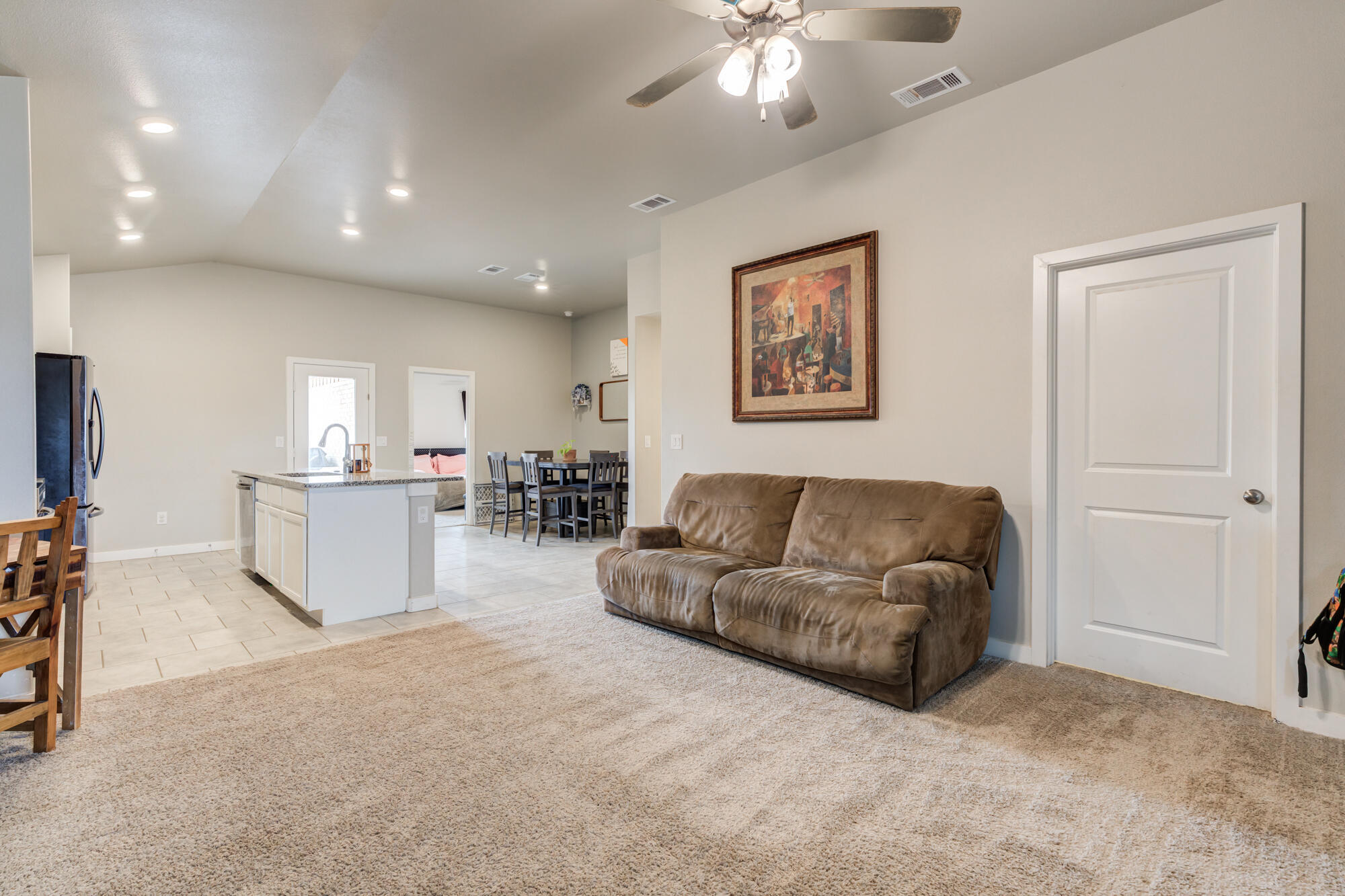 7429 31st Street Lubbock, TX 79407 - Photo 6 of 29 a living room with furniture and a flat screen tv
