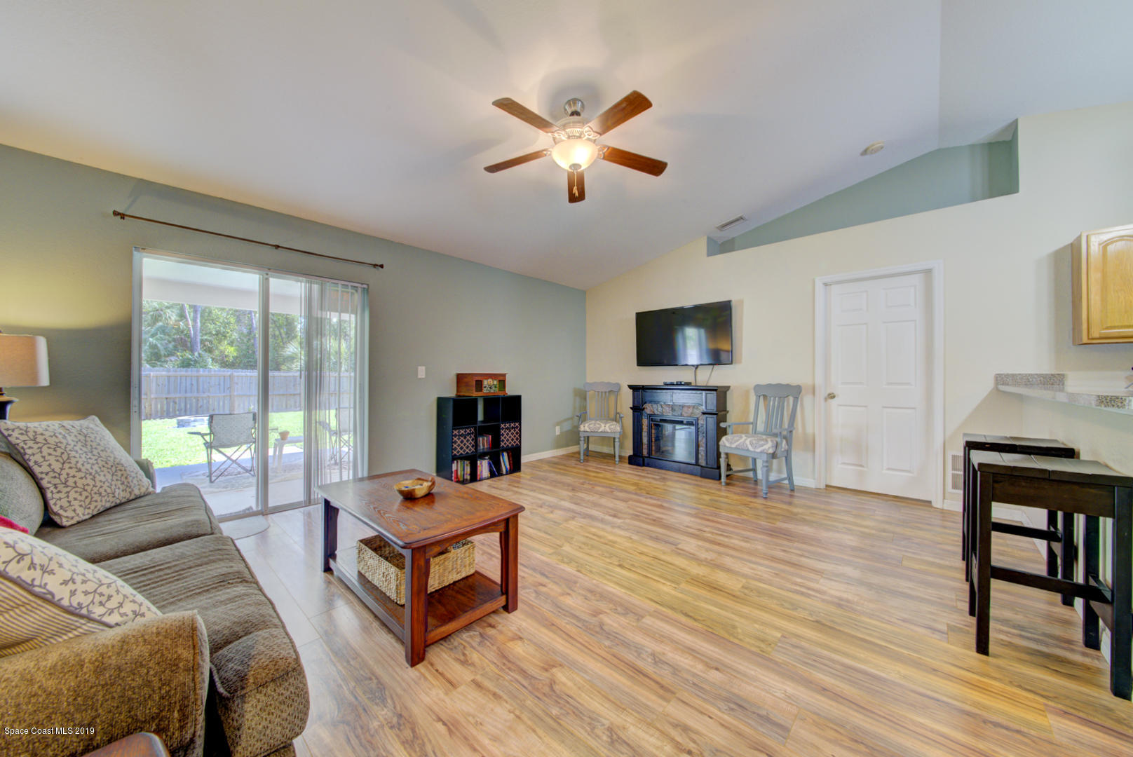 419 Hamer Road Southwest Palm Bay, FL 32908 - Photo 14 of 33 living room with sliders to backyard