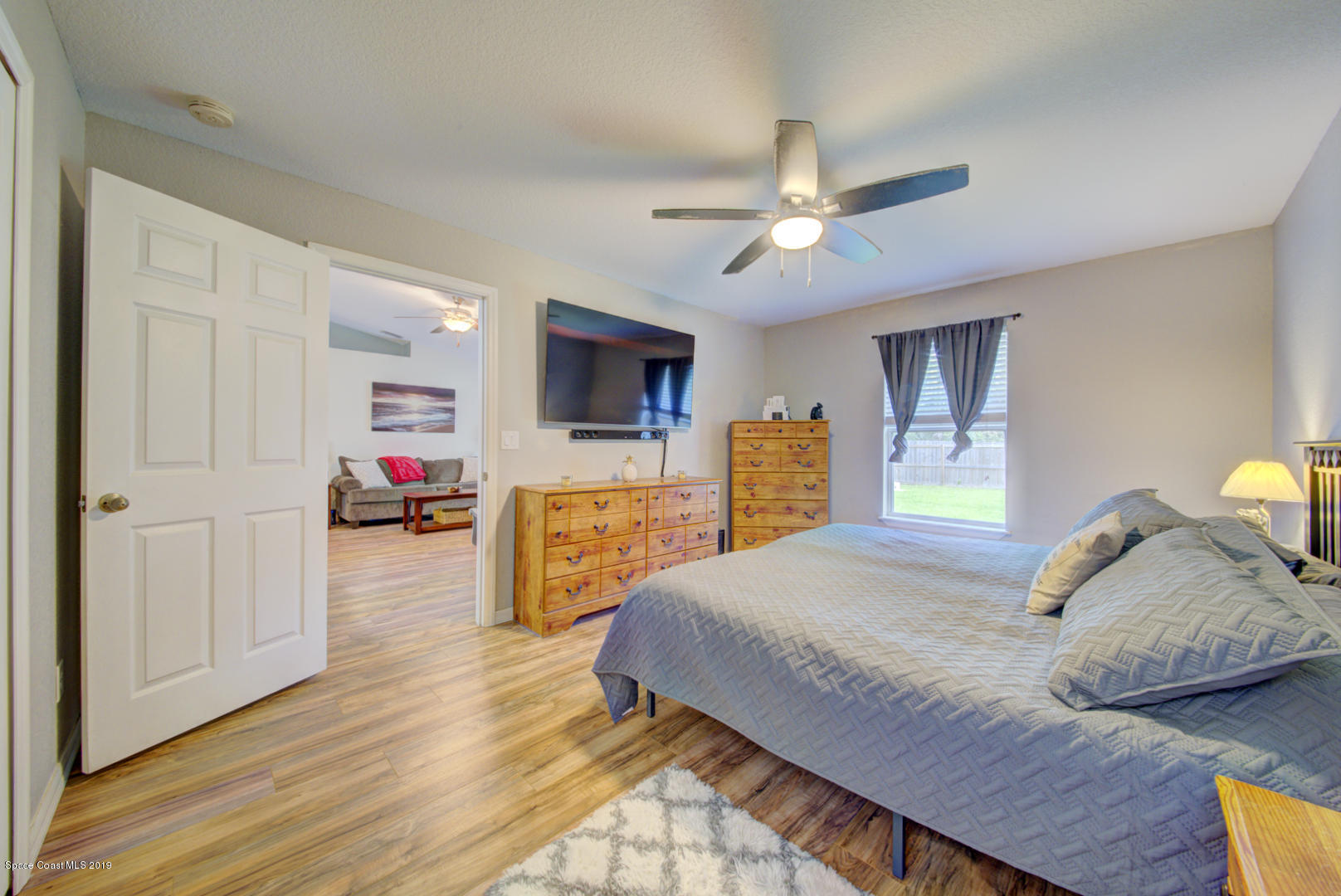 419 Hamer Road Southwest Palm Bay, FL 32908 - Photo 17 of 33 master bedroom with ceiling fan