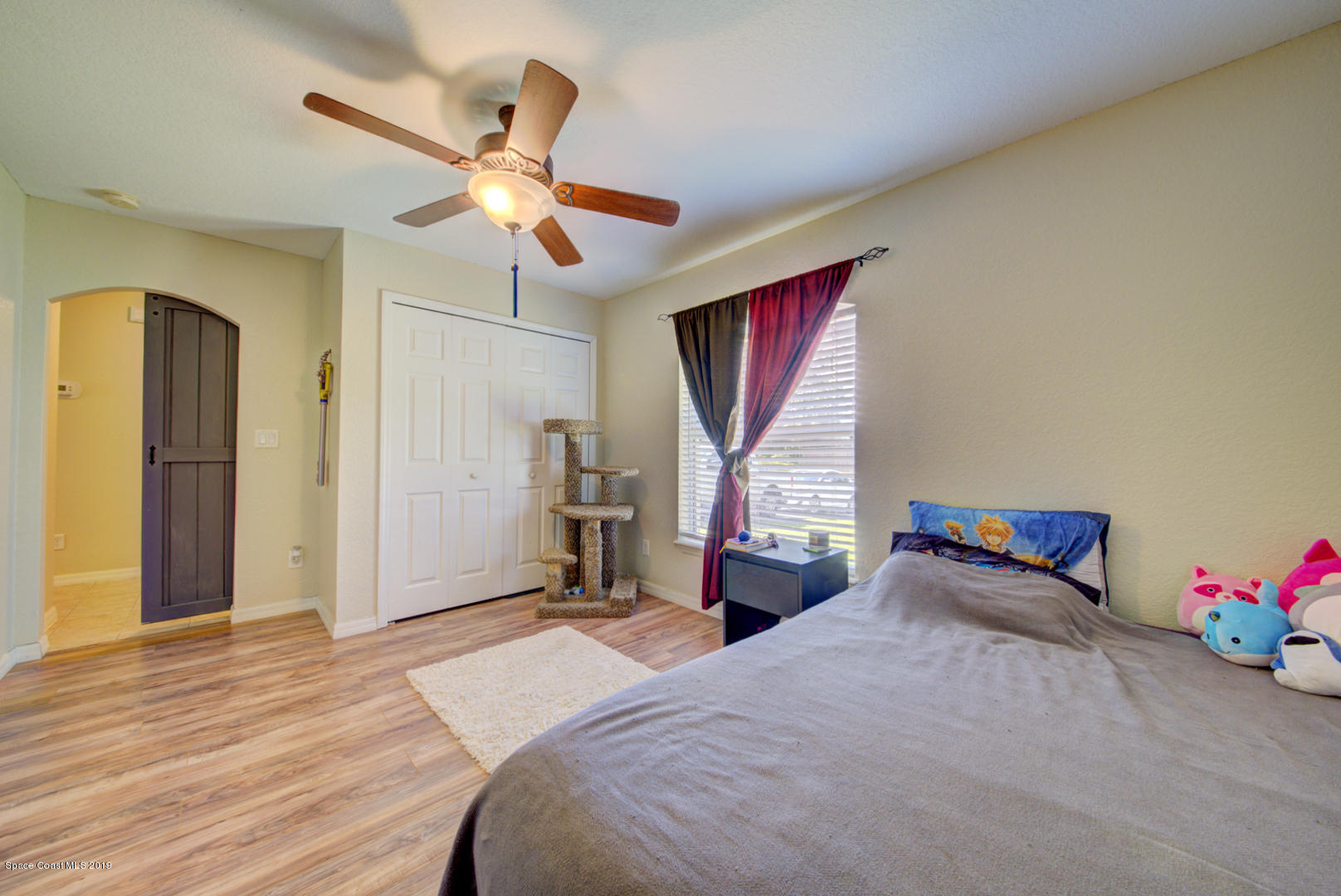 419 Hamer Road Southwest Palm Bay, FL 32908 - Photo 27 of 33 bedroom 4 with barn door