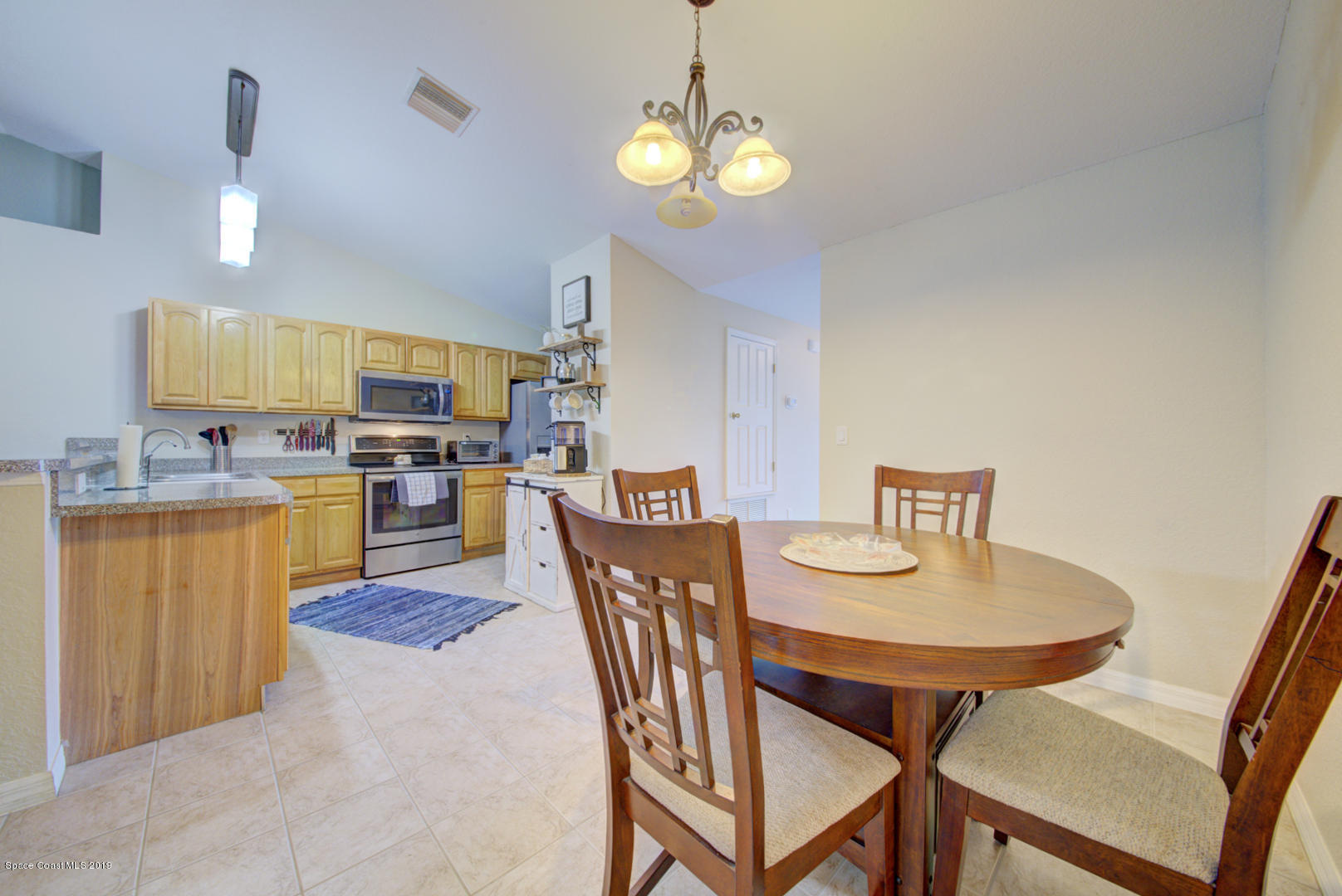 419 Hamer Road Southwest Palm Bay, FL 32908 - Photo 8 of 33 dining area open to kitchen