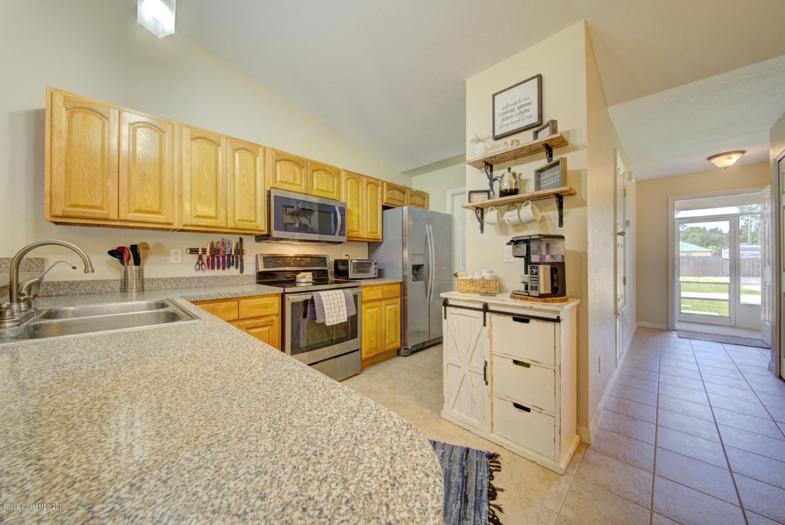 419 Hamer Road Southwest Palm Bay, FL 32908 - Photo 9 of 33 kitchen with vaulted ceiling